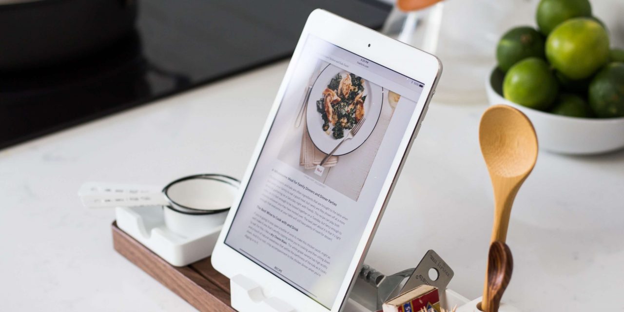 kitchen counter with a tablet showing a recipe